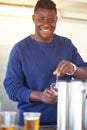 Portrait, party and a black man bartender serving drinks outdoor at an event, festival or celebration. Smile, beer and Royalty Free Stock Photo