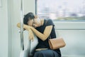 Passenger woman sitting and sleeping in a train