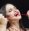 Portrait of Passionate Screaming Sensual Bunette Woman Biting Her Beads Royalty Free Stock Photo