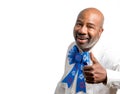 Portrait of a patriotic african american man giving thumbs up with Fourth of July bow tie white backdrop  with blank space for Royalty Free Stock Photo