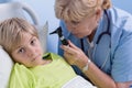 Portrait of pediatrician using otoscope Royalty Free Stock Photo