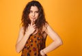 Portrait of a pensive curly haired girl looking away