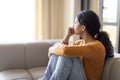 Portrait Of Pensive Depressed Young Indian Woman Sitting On Couch At Home Royalty Free Stock Photo