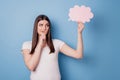 Portrait of pensive doubtful lady finger chin hold thought bubble look empty space on blue background