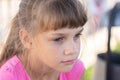 Portrait of a pensive European girl eight years old