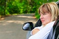 Portrait of a pensive female driver 50 years