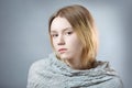 Portrait of pensive girl in gray pastel colors