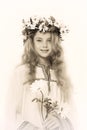 Portrait of a pensive girl with a wreath of flowers on her head Royalty Free Stock Photo