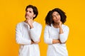 Portrait of pensive interracial couple thinking about something and looking away Royalty Free Stock Photo