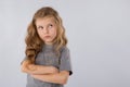 Portrait of pensive little girl isolated on a white background