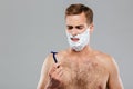 Portrait of a pensive man before shaving Royalty Free Stock Photo