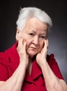 Portrait of pensive old woman