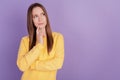 Portrait of pensive ponderous positive lady finger chin look empty space create idea on purple background