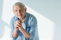 Portrait of pensive senior man in stylish shirt Royalty Free Stock Photo