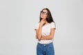 Portrait of a pensive young asian woman in eyeglasses looking Royalty Free Stock Photo