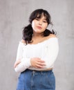 Portrait of pensive young girl posing in studio Royalty Free Stock Photo