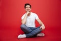 Portrait of a pensive young man in white t-shirt Royalty Free Stock Photo