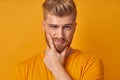 Portrait of a pensively handsome caucasian bearded man having doubts and with confuse face expression