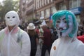 Portrait of people protesting in the street against the sanitary pass with the anonymous mask on head