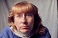 Portrait of perplexed puzzled middle-aged woman on a white background. Unprofessional female model posing in the Studio