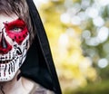 portrait of a person with scary makeup done for day of the dead, dia de los Muertos, traditional holiday in Mexico