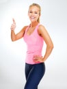 Portrait, personal trainer and woman with thumbs up for exercise, studio and support or vote for fitness. Adult, female Royalty Free Stock Photo