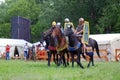 Portrait of persons in historical costumes, they ride horses