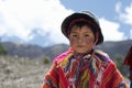 Portrait of a Peruvian boy dressed in colorful handmade outfit. Royalty Free Stock Photo