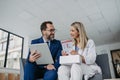 Pharmaceutical sales representative talking with doctor in medical building. Ambitious male sales representative Royalty Free Stock Photo