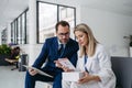 Pharmaceutical sales representative talking with doctor in medical building. Ambitious male sales representative Royalty Free Stock Photo