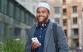 Portrait, phone and muslim with an man in the city on his morning commute listening to music during the day. Mobile Royalty Free Stock Photo