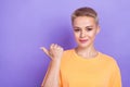 Portrait photo of adorable pretty young promoter woman wear stylish orange t-shirt point thumb mockup useful tips