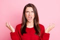 Portrait photo of aggressive outraged young girl wearing red outfit gesturing with both hands grinning opened mouth