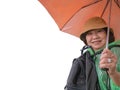 Portrait Photo of Beautiful Senior asian women backpecker Holding the umbrella Royalty Free Stock Photo