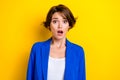 Portrait photo of confused speechless unhappy young business woman wear blue jacket scared bad news reaction isolated on