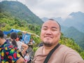 Portrait photo of Fun tourist on the peak of Pha Ngeun in vangvieng City Laos.