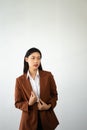 Portrait photo of young beautiful Asian woman feeling happy and holding smart phone, tablet and laptop with black empty screen on Royalty Free Stock Photo