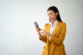 Portrait photo of young beautiful Asian woman feeling happy and holding smart phone, tablet and laptop with black empty screen on Royalty Free Stock Photo