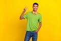 Portrait photo of young confident handsome man smiling music wireless hold hand pocket jeans showing v-sign peace hello Royalty Free Stock Photo