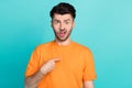 Portrait photo of young funny excited unhappy grimace man student wear orange t-shirt point finger himself stressed