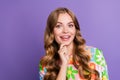 Portrait photo of young gorgeous adorable blonde curly hair woman touch chin thinking but excited isolated on purple Royalty Free Stock Photo