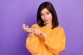 Portrait photo of youngster pretty woman wear orange sweater count numbers fingers showing leader boss worker isolated Royalty Free Stock Photo