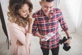 Photographer viewing the result of his photo print to his model