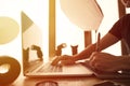 photographer at work, at sunset, in his studio with PC and tablet