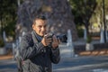 Portrait of a photojournalist working on the street