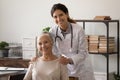 Portrait of physician and senior woman patient looking at camera Royalty Free Stock Photo