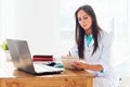 Portrait of physician working in her office Royalty Free Stock Photo