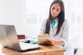 Portrait of physician working in her office Royalty Free Stock Photo