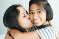 Portrait picture of love family mother on the kiss  daughter; Cute girl smile beautiful and happy on bed Royalty Free Stock Photo