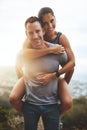 Portrait, piggy back and couple with hug, outdoor or lens flare with happiness, love or freedom. Face, man carrying